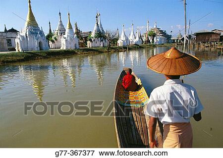 Monk on boat for alms. Inle Lake. Shan State. Myanmar. View Large Photo Image Stock Photo - Monk on boat for alms. Inle Lake. Shan State. Myanmar.. Fotosearch