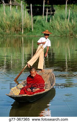 Monk on boat for alms. Inle Lake. Shan State. Myanmar. View Large Photo Image Stock Photography - Monk on boat for alms. Inle Lake. Shan State. Myanmar.. Fotosearch