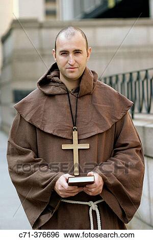 Monk. Priest holding Bible. View Large Photo Image Stock Photograph - Monk. Priest holding Bible.. Fotosearch