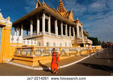 Monk walk outside the Royal Palace. Phnom Penh. The Royal Palace of Cambodia is a complex of buildings View Large Photo Image Stock Image - Monk walk outside the Royal Palace. Phnom Penh. The Royal Palace of Cambodia is a complex of buildings. Fotosearch