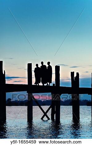 Monks at U Bein bridge View Large Photo Image Stock Photo - Monks at U Bein bridge. Fotosearch