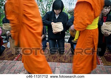 Monks collecting alms at sunrise. Luang Prabang. North Laos. Laos. View Large Photo Image Stock Image - Monks collecting alms at sunrise. Luang Prabang. North Laos. Laos.. Fotosearch