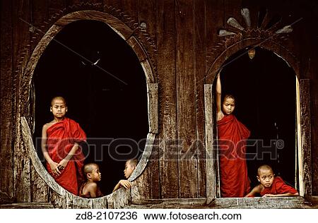 Monks in the windows of a teak monastery. Myanmar. View Large Photo Image Stock Photograph - Monks in the windows of a teak monastery. Myanmar.. Fotosearch