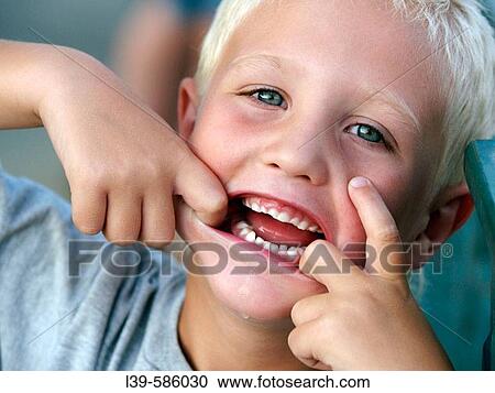 Monster Face-is a shot of a little boy at a forth of July celebration in Peoria. IL. U. S. A. View Large Photo Image Stock Image - Monster Face-is a shot of a little boy at a forth of July celebration in Peoria. IL. U. S. A.. Fotosearch