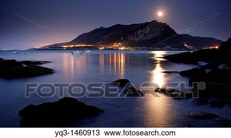 Stock Image - Montaa Oriental Costera under the moonlight, Castro Urdiales, Cantabria, Spain. Fotosearch