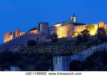 Stock Image - Montemor o Velho, Castle at Dusk, Coimbra district, Beiras region, Portugal, Europe.. Fotosearch