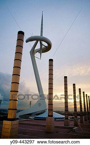 Stock Photo - Montjuic Communications Tower (Torre Telef? nica) by Santiago Calatrava (1991) and street lamps in the afternoon, Anella Ol? mpica. Barcelona. Catalonia, Spain. Fotosearch