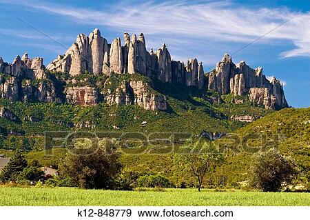 Stock Photo - Montserrat Mountain viewed from Sant Crist? fol. Bages. Barcelona Province. Catalonia. Spain / Macizo de la Montaa de Montserrat, visto desde Sant Crist? fol, en la Comarca del Bages. Prov? ncia de Barcelona. Catalua. Espaa. Fotosearch