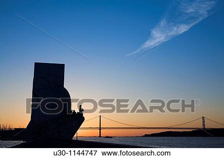 Monument to the Discoverers and 25 April Bridge at dawn, in Belem, Lisbon city, next to the mounth of Tagus river in Atlantic Ocean Portugal View Large Photo Image Stock Photo - Monument to the Discoverers and 25 April Bridge at dawn, in Belem, Lisbon city, next to the mounth of Tagus river in Atlantic Ocean Portugal. Fotosearch