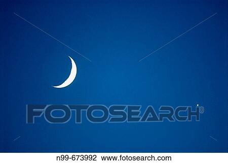 Moon and Venus, planet Venus in close position to crescent moon, waxing moon, night sky on a summer evening, Bavaria, Germany View Large Photo Image Stock Image - Moon and Venus, planet Venus in close position to crescent moon, waxing moon, night sky on a summer evening, Bavaria, Germany. Fotosearch