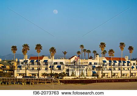 Moon rising over the Sandcastle Inn, along the shore at Pismo Beach, California. View Large Photo Image Stock Image - Moon rising over the Sandcastle Inn, along the shore at Pismo Beach, California.. Fotosearch