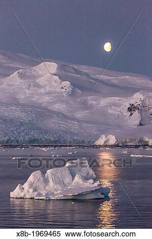 Moonrise over icebergs in the Gerlache Strait, Antarctica, Southern Ocean. View Large Photo Image Stock Photography - Moonrise over icebergs in the Gerlache Strait, Antarctica, Southern Ocean.. Fotosearch