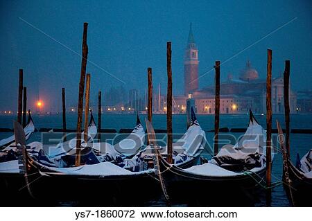 Stock Image - Moored gondolas covered with snow, St Mark's basin, Venice, Italy, Europe. Fotosearch