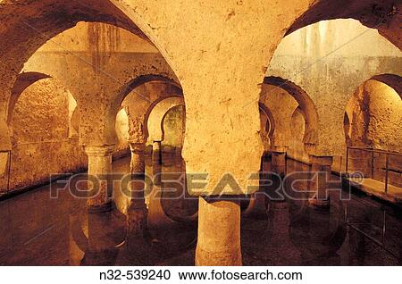Moorish? aljibe? (water cistern) in the cellar of the Palacio de las Veletas, CBceres. Extremadura, Spain View Large Photo Image Stock Image - Moorish? aljibe? (water cistern) in the cellar of the Palacio de las Veletas, CBceres. Extremadura, Spain. Fotosearch