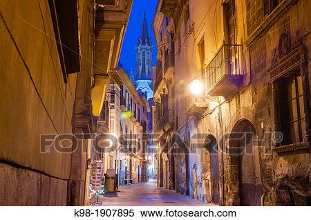 Morey street and bell tower of the Gothic church of Santa Eulalia, XIV-XIX, Mallorca, Balearic Islands, Spain View Large Photo Image Stock Photography - Morey street and bell tower of the Gothic church of Santa Eulalia, XIV-XIX, Mallorca, Balearic Islands, Spain. Fotosearch