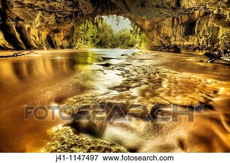 Moria Gate arch with limestone stalagtites on roof, swollen Oparara river, near Karamea, Kahurangi National Park, West Coast, New Zealand View Large Photo Image Stock Photo - Moria Gate arch with limestone stalagtites on roof, swollen Oparara river, near Karamea, Kahurangi National Park, West Coast, New Zealand. Fotosearch
