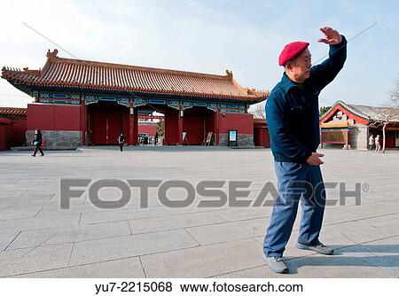 Morning exercises in Jingshan Park in Beijing, China. Behind the man: North Gate of Jingshan Park. View Large Photo Image Stock Photo - Morning exercises in Jingshan Park in Beijing, China. Behind the man: North Gate of Jingshan Park.. Fotosearch