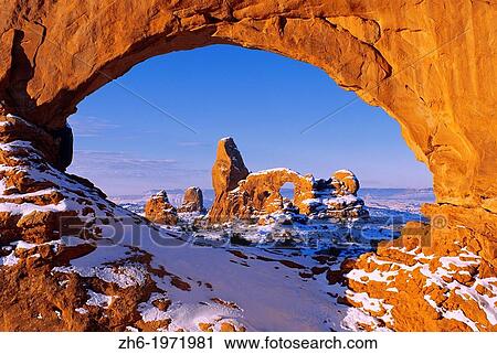 Morning light on North Window framing Turret Arch in winter, Arches National Park, Utah USA. View Large Photo Image Stock Image - Morning light on North Window framing Turret Arch in winter, Arches National Park, Utah USA.. Fotosearch