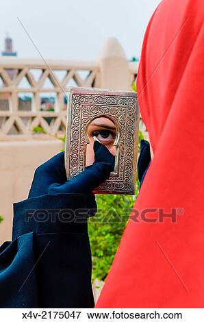 Moroccan girl making up, Koutoubia minaret on the background, Marrakech (Marrakesh), Morocco, North Africa, Africa, M. R. View Large Photo Image Stock Photo - Moroccan girl making up, Koutoubia minaret on the background, Marrakech (Marrakesh), Morocco, North Africa, Africa, M. R.. Fotosearch