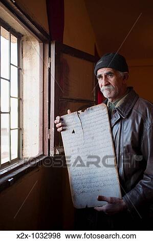 Moroccan man showing a Koranic school ancient board, Oujda, Oriental region, Morocco View Large Photo Image Stock Photo - Moroccan man showing a Koranic school ancient board, Oujda, Oriental region, Morocco. Fotosearch