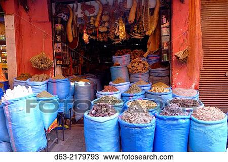 Stock Image - Morocco - Marrakesh. Beans and herbs on sale in market. Fotosearch