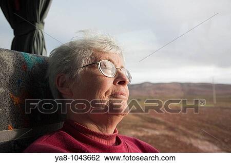 Morocco Senior woman asleep on coach seat by window MR 08/20 View Large Photo Image Stock Image - Morocco Senior woman asleep on coach seat by window MR 08/20. Fotosearch