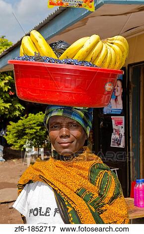 Mosquito Village Mto wa Mbu Tanzania Africa village woman with bananas on head for sale to tourists 4 View Large Photo Image Stock Photo - Mosquito Village Mto wa Mbu Tanzania Africa village woman with bananas on head for sale to tourists 4. Fotosearch