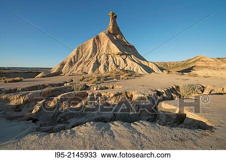 Most renowned cliff eroded by rainfall, symbol of the clay-only area of the natural park of Bardenas Reales de Navarra, Navarre, Spain. View Large Photo Image Stock Image - Most renowned cliff eroded by rainfall, symbol of the clay-only area of the natural park of Bardenas Reales de Navarra, Navarre, Spain.. Fotosearch