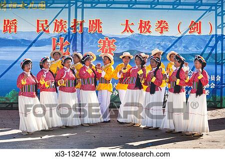 Mosuo women dancing, wearing traditional costume, Lijiang, Yunnan Province, China View Large Photo Image Stock Image - Mosuo women dancing, wearing traditional costume, Lijiang, Yunnan Province, China. Fotosearch