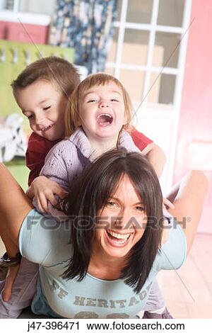 mother, 30, giving her 2 children, boy 3 and girl 18months. a piggy back ride, laughing View Large Photo Image Stock Image - mother, 30, giving her 2 children, boy 3 and girl 18months. a piggy back ride, laughing. Fotosearch