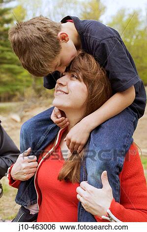 Mother (age 40) and son (age 9), Mother's Day, New Paltz, New York. USA. View Large Photo Image Stock Photograph - Mother (age 40) and son (age 9), Mother's Day, New Paltz, New York. USA.. Fotosearch