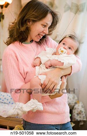 Mother and 9 months girl View Large Photo Image Stock Photo - Mother and 9 months girl. Fotosearch