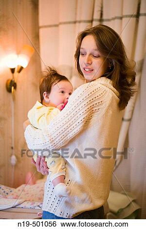 Mother and 9 months girl View Large Photo Image Stock Photograph - Mother and 9 months girl. Fotosearch