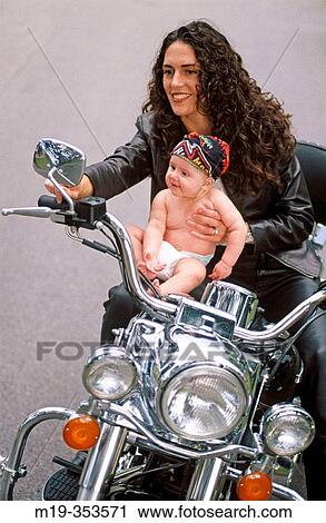 Mother and baby on motorbike View Large Photo Image Stock Image - Mother and baby on motorbike. Fotosearch