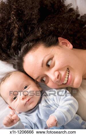 Stock Photograph - Mother and baby.. Fotosearch