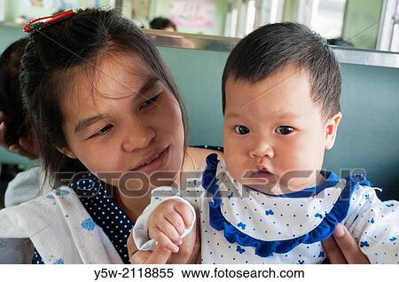 Mother and child aboard the train from Bangkok to Ayutthaya. View Large Photo Image Stock Photography - Mother and child aboard the train from Bangkok to Ayutthaya.. Fotosearch