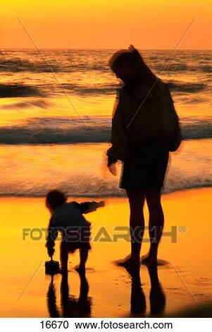 Mother and child at beach View Large Photo Image Stock Image - Mother and child at beach. Fotosearch