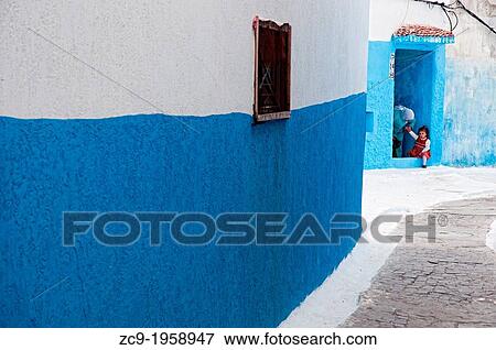 Mother and child at her home doorway, Kasbah of the oudayas, Rabat, Morocco. View Large Photo Image Stock Photo - Mother and child at her home doorway, Kasbah of the oudayas, Rabat, Morocco.. Fotosearch