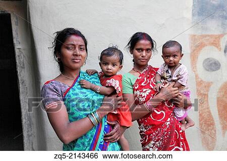 Mother and child. Kurmi caste. Bhilwara village, district Hazaribaug, Jharkhand, India. View Large Photo Image Stock Photograph - Mother and child. Kurmi caste. Bhilwara village, district Hazaribaug, Jharkhand, India.. Fotosearch