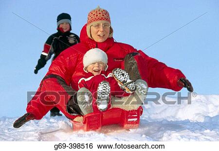 Mother and child on a small sledge. Medle. V? sterbotten, Sweden View Large Photo Image Stock Photograph - Mother and child on a small sledge. Medle. V? sterbotten, Sweden. Fotosearch