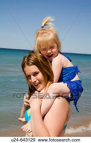 Mother and Child on Beach, Sandbanks Provincial Park, Ontario, Canada. View Large Photo Image Stock Photo - Mother and Child on Beach, Sandbanks Provincial Park, Ontario, Canada.. Fotosearch