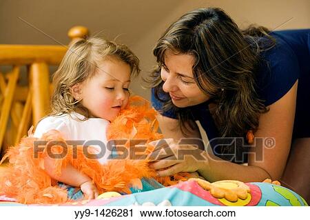 Stock Image - Mother and child playing - Cabanas Del Lago - Lake San Pablo, near Otavalo, Ecuador. Fotosearch