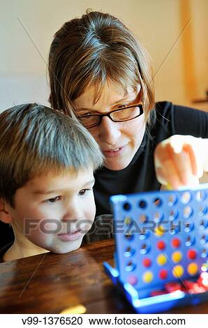 Mother and child playing together View Large Photo Image Stock Image - Mother and child playing together. Fotosearch