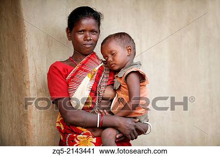 Stock Image - Mother and child. Soren tribe. Hardhekitand village, Dist Bokaro, Jharkhand, India.. Fotosearch