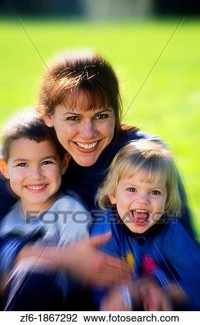 Mother and children portrait outside View Large Photo Image Stock Image - Mother and children portrait outside. Fotosearch