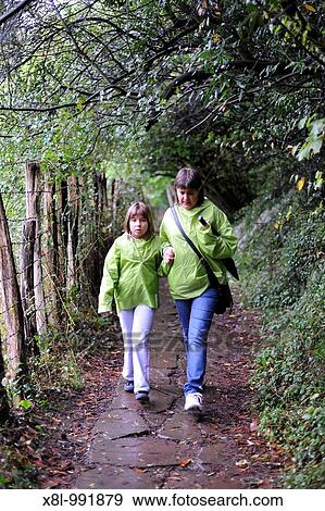 Mother and daughter 9 years walking in the country View Large Photo Image Stock Photo - Mother and daughter 9 years walking in the country. Fotosearch