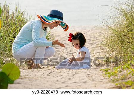 Mother and Daughter at Beach - Lauderdale-by-the-Sea, Florida USA. View Large Photo Image Stock Photo - Mother and Daughter at Beach - Lauderdale-by-the-Sea, Florida USA.. Fotosearch