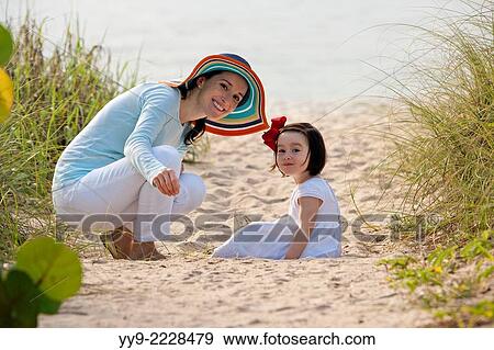 Stock Photo - Mother and Daughter at Beach - Lauderdale-by-the-Sea, Florida USA.. Fotosearch