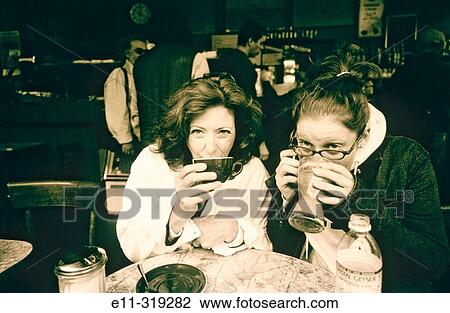 Stock Image - Mother and daughter at caf?. Fotosearch