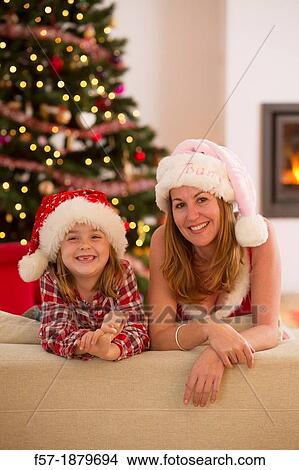 Mother and daughter at Christmas time View Large Photo Image Picture - Mother and daughter at Christmas time. Fotosearch